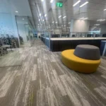 Office floor with patterned carpet tiles at Bank AlJazira HQ, Jeddah