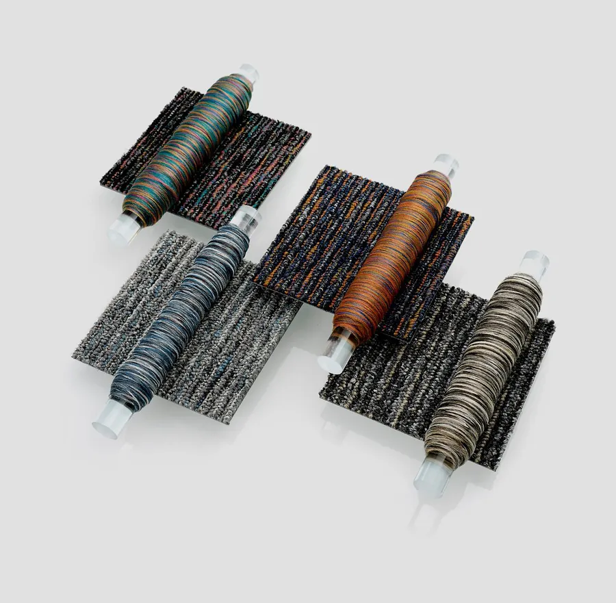 Mohawk carpet tile samples with yarn spools